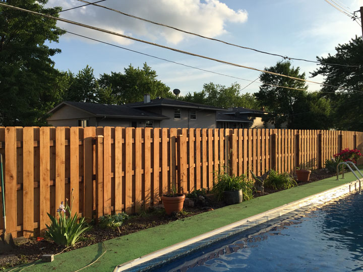 Photo of Wood Shadowbox Fence Installed Next To Pool