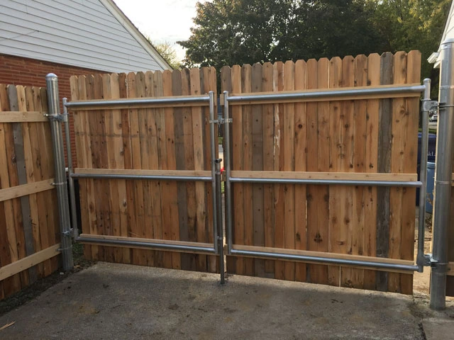 Wood Privacy Fence Gate in Residential Driveway